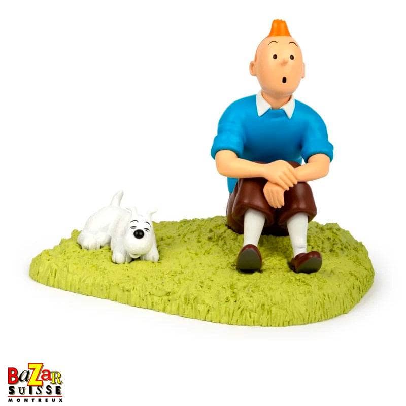 Tintin sitting in the grass figurine